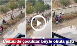 Bismil’de çocuklar göle dönen yolda böyle okula gitti