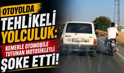 Otoyolda Tehlikeli Yolculuk: Kemerle Otomobile Tutunan Motosikletli Şoke Etti